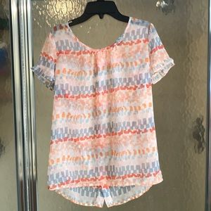 Pastel short sleeved blouse with flower buttons